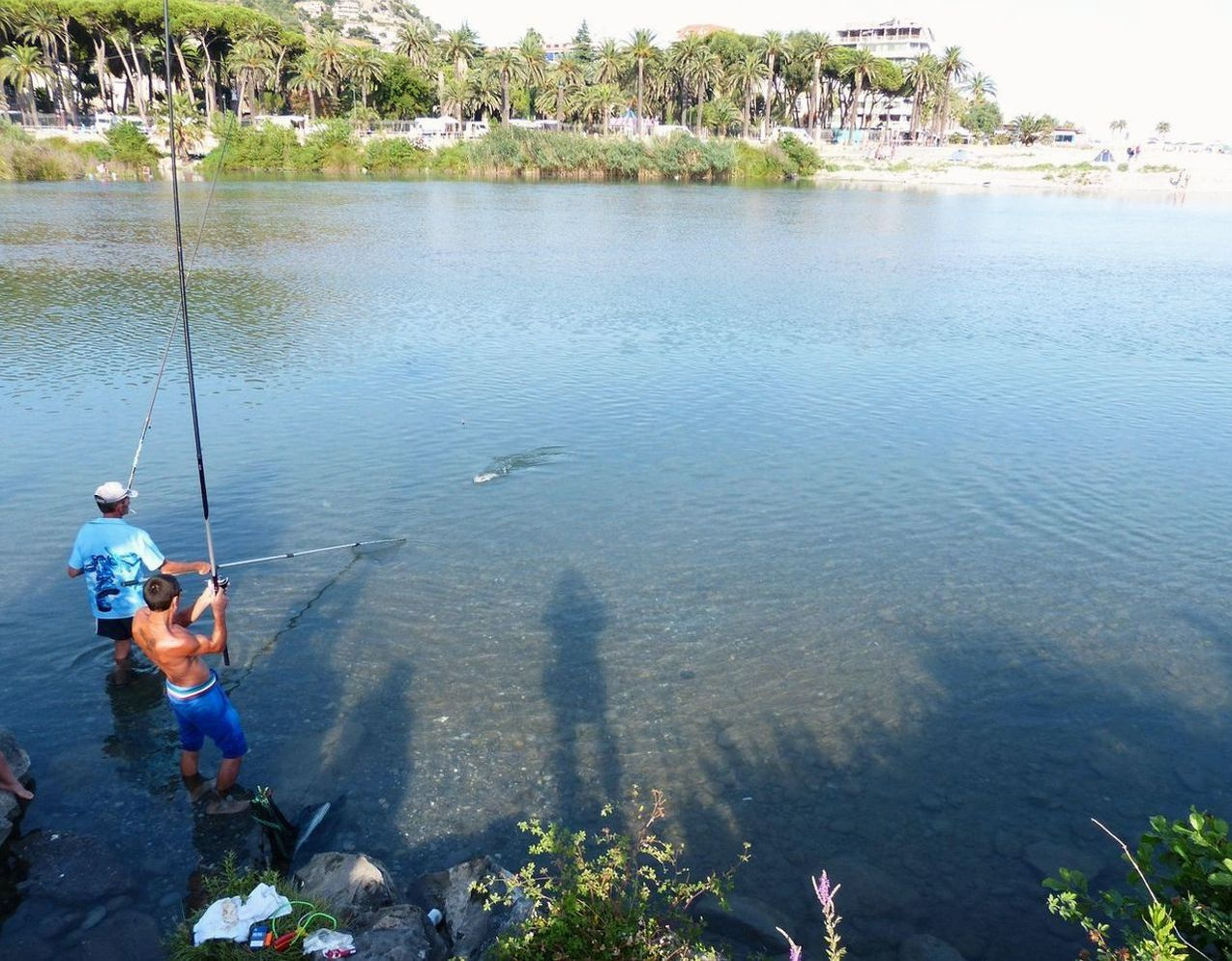 Angler checking fishing line strength and tackle selection by natural light