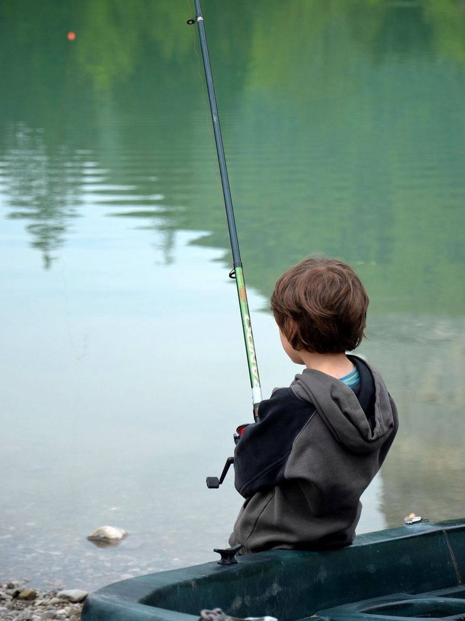 Portrait of angler holding prize catch